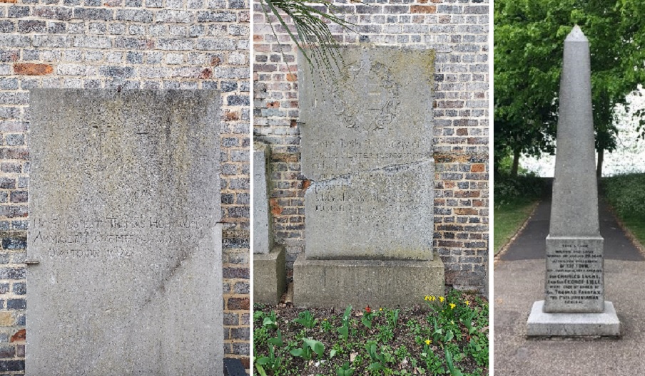 two gravestones of the Honywood's stood against a brick wall, and the grey pointed obelisk standing in the lush green park
